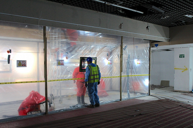 asbestos enclosure in demolition site hotel