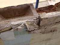 Close up of the cleaned bricks where asbestos has already been fully removed from the windowsills