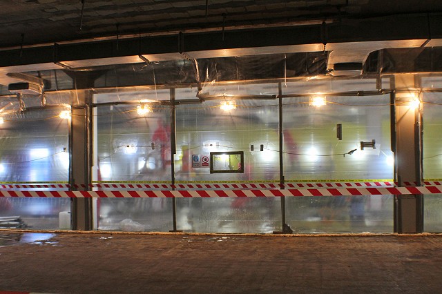 Operatives removing asbestos in an enclosure