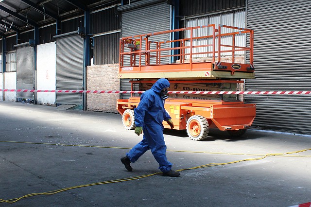 Outside asbestos operative on waste run half face mask